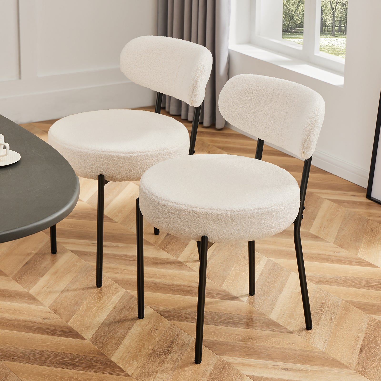 Modern cushioned dining chair with black steel frame for dining room