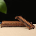 wooden plant holder for purple clay pot display